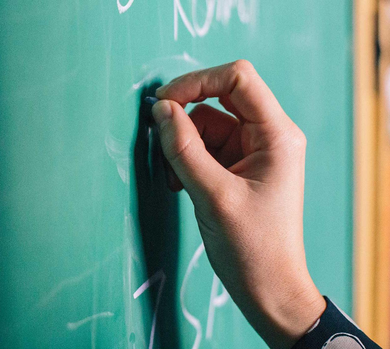 hand writing on chalkboard