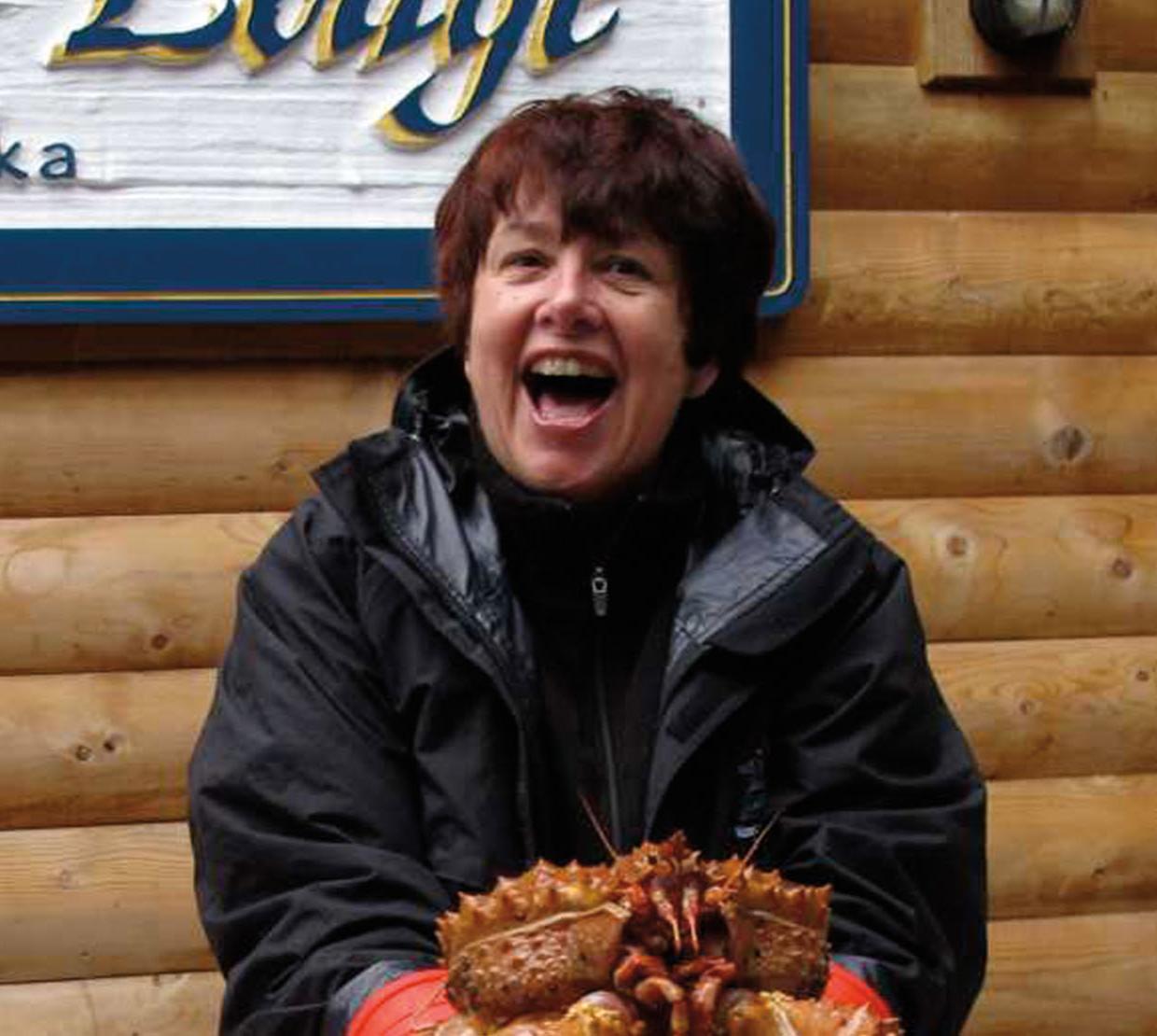 Judy Faucett holding a crab.