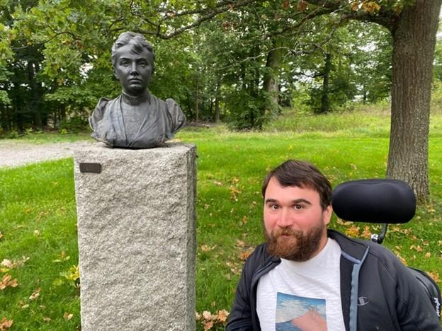 Patrick Nabelek next to statue of Sophia Kovalevskaya.