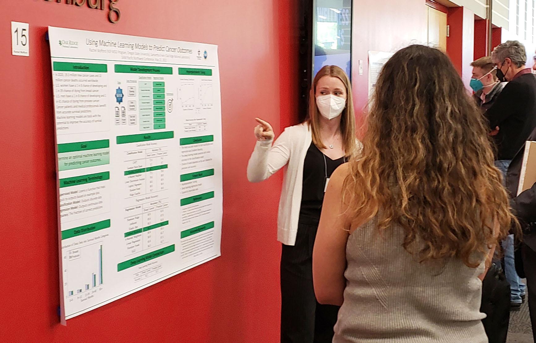Rachel Wofford in front of her poster on Using Machine Learning Models to Predict Cancer Outcomes at the SIAM PNW Section Meeting at WSU Vancouver, May 2022