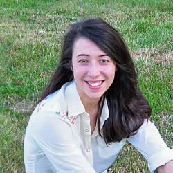 Kirana Bergstrom sitting in grass.