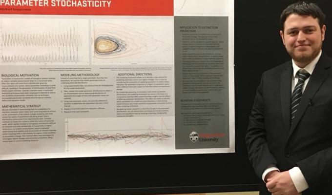 Michael Kupperman in front of his research poster