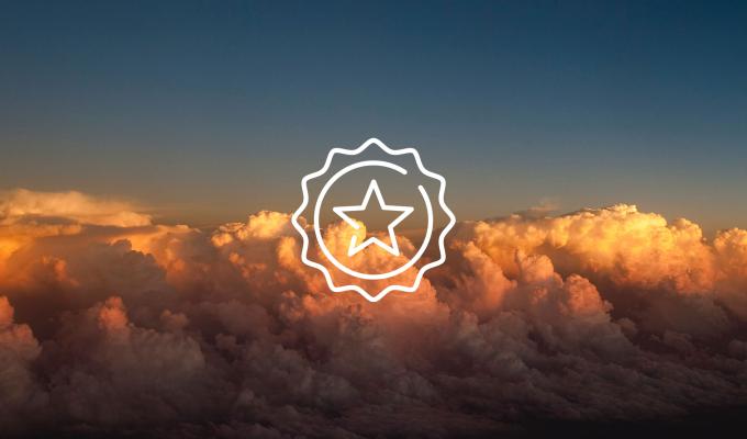 star icon above image of clouds at sunset