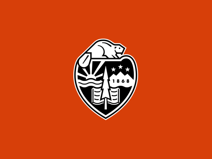 The Oregon State University crest on a field of orange