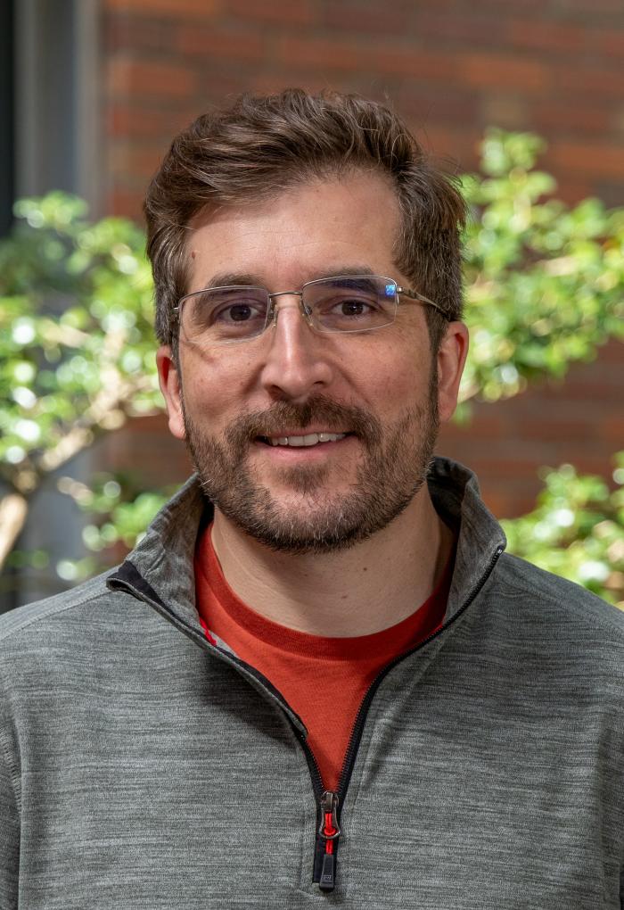 headshot of Adam Chouinard