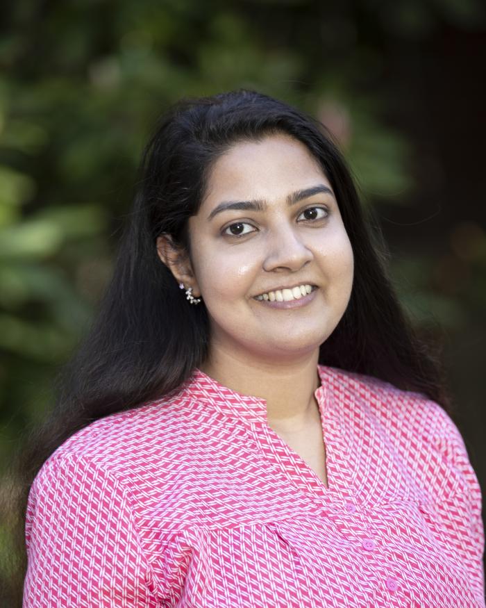 Headshot of Praveeni Mathangadeera smiling in a colorful shirt