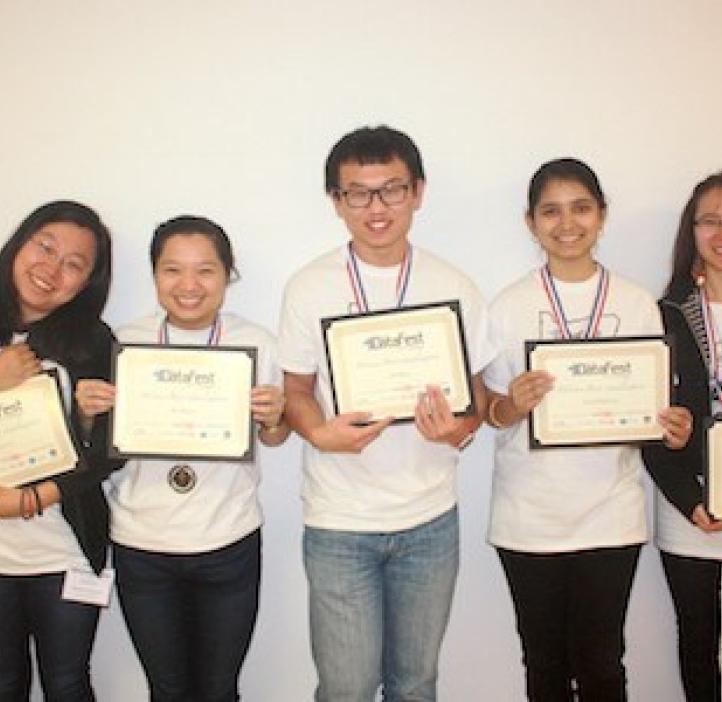 student winners holding awards in group photo