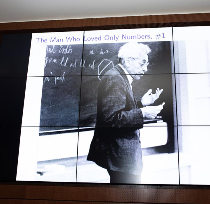 A slide from the lecture references famous mathematician Paul Erdős. 