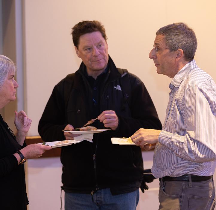 Virginia Weis, Bill Bogley, and Michael Learner talking