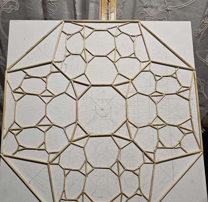 A process shot of the artwork with wooden edges of hyperbolic space laid out on canvas